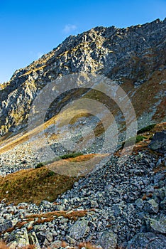 Rocky Tatra mountain tourist hiking trails under blue sky in Slovakia