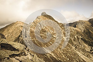 Rocky Tatra mountain tourist hiking trails under blue sky in Slovakia - vintage retro look