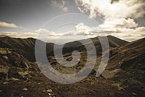 Rocky Tatra mountain tourist hiking trails under blue sky in Slovakia - vintage retro look