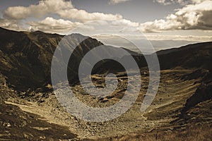 Rocky Tatra mountain tourist hiking trails under blue sky in Slovakia - vintage retro look