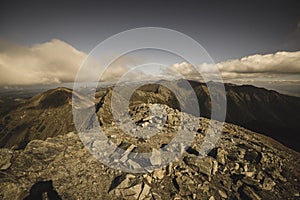 Rocky Tatra mountain tourist hiking trails under blue sky in Slovakia - vintage retro look