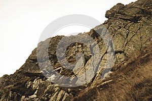 Rocky Tatra mountain tourist hiking trails under blue sky in Slovakia - vintage retro look