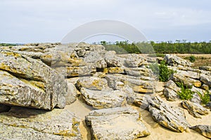 Rocky terrain in abandoned places. Blue clouds.