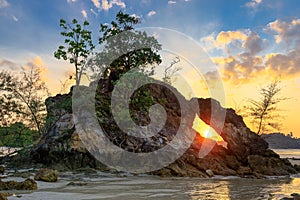 Rocky tropical coastline at sunset