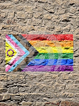 Rocky wall with a LGBT flag and intersexual flag painted on it