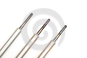 Rod ceramic glow plugs for a diesel engine on a white background, close-up, isolate. Heating element