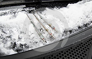 Rod ceramic glow plugs on an icy car hood in winter. Heating elements of the combustion chamber of a diesel engine on