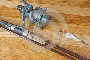 Rod with lure on wood desk