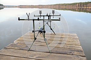 Rod pod with electronic bite alarms on pier by lake