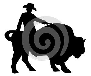 Rodeo man on a buffalo, bison, bull, silhouette.