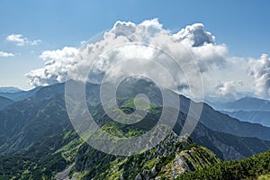 Rodica peak during summer in sunny and cloudy day, view from Sija peak, Julian Alpe, Slovenia