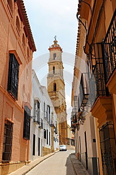 Rodrigo Caro street with the church of Santa Maria de la Mesa in Utrera, Spain photo