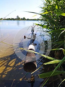 Rods on the pontoon of the lake for carp fishing