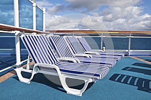 Roe of deck chairs on sundeck of the cruise ship