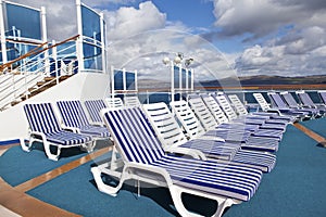 Roe of deck chairs on sundeck of the cruise ship