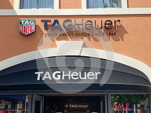 View on store facade with logo lettering of tag heuer swiss luxury watches comany