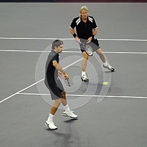 Roger Federer and Bjorn Borg in actions