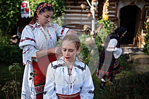 Rogoz, Romania, October 12th, 2019, Portraiture of children wearing traditional in Maramures making up hair