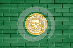 Rohingya flag painted on a brick wall, Background texture.