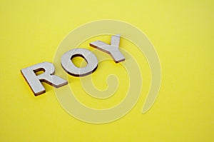 ROI wooden letters representing Remainder Of Year on yellow background