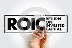ROIC Return on Invested Capital - ratio used in finance, valuation and accounting, as a measure of the profitability, acronym text