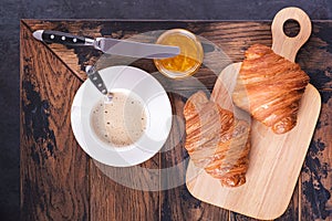 Ð¡roissant and cappuccino on table