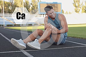 Role of calcium for human. Man suffering from pain in knee at stadium