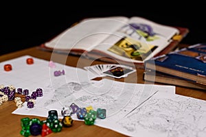 Role playing game set up on table isolated on black background