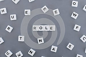 Role word made of square letter word on grey background