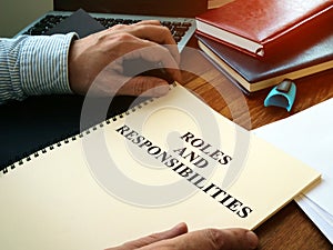 Roles And Responsibilities book on the desk
