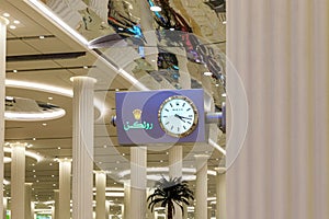 Rolex large wall clock in the baggage claim area at the Dubai International Airport in Dubai city, United Arab Emirates