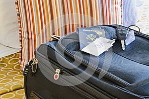 Roll Aboard Bag on a Hotel Bed photo