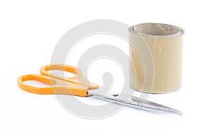 Roll of adhesive tape and scissors