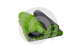 Roll of artificial green grass isolated on white background, covering for playgrounds and sports grounds