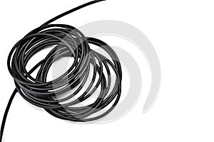 Roll of black power cord isolated on white background