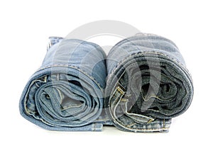 roll blue denim jeans arranged in stack