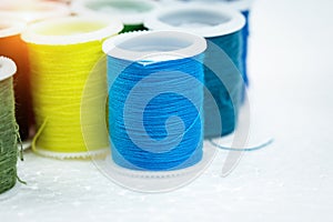 The roll of blue thread put on background,for needlework,craft,sewing