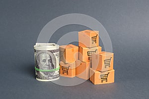 Roll bundle of dollars and cardboard boxes. International trade and trading balance. Global market and business, import and export