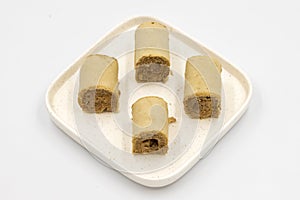 Roll cake with hazelnut and chocolate filling. roll cake on a white background.