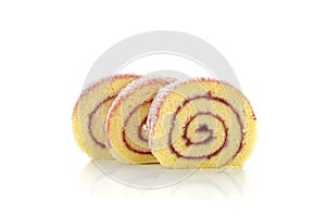 Roll cake with raspberry jam on white background