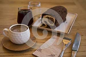 The roll cake and Turkish coffee service concept in the cafe .