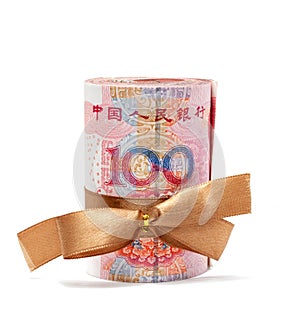 Roll of chinese yuan banknotes tied with gold ribbon isolated on white