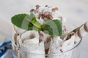 Roll of coconut ice cream. Fresh fried ice cream, ice roll on a