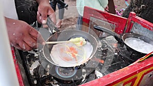 Roll the dough yeast. Male Hands of chef making cake close-up. Asian street food, cake made out of sweet dough rolled