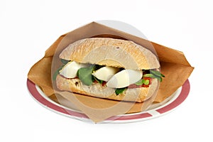 Roll filet americain filet sandwich.