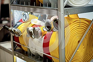 Roll of fire hoses of different colors