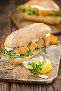 Roll with fried Fish Sticks (close-up shot)