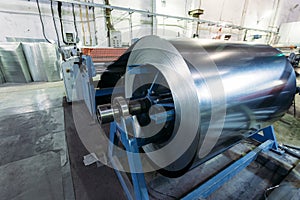 Roll of galvanized steel sheet feeds steel sheets to the cutting machine for manufacturing metal pipes and tubes