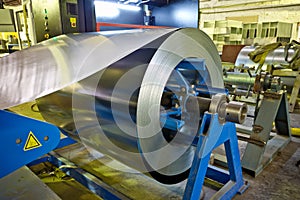 Roll of galvanized steel sheet for manufacturing metal pipes and tubes in the factory photo