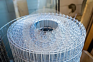 Roll of galvanized wire mesh, close-up. Universal building material for fencing